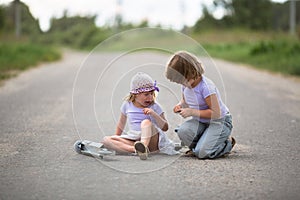 Girl scooter fell In the countryside, sister helps her child
