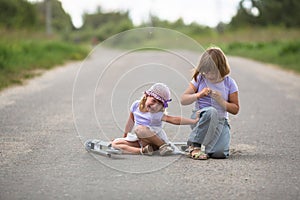 Girl scooter fell In the countryside, sister helps her child