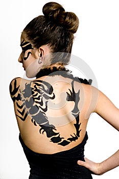 Girl with scorpio painted on back photo