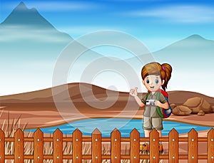 A girl scout going for a walk on dry land