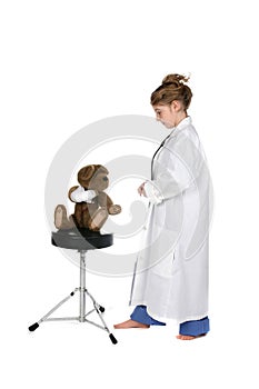 Girl in scrubs attending to a bear