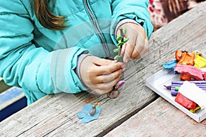 Girl sculpts plasticine