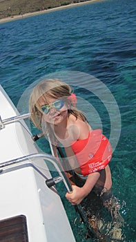 Girl in sea with armbands