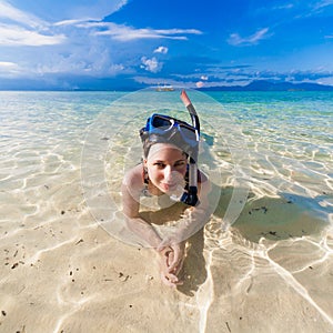 Girl into the sea with mask