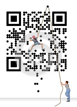 A girl is seen bouldering her way up a climbing wall that looks like a QR code