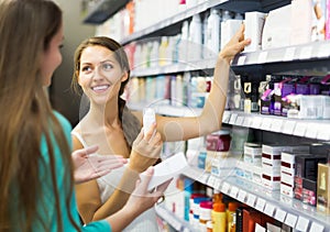 Girl selecting cosmetical cream