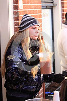 Girl selling hot chocolate drinks