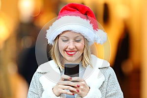 Girl sending phone messages in christmas holidays