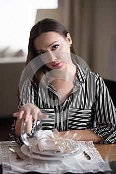 A girl with a serious look in a restaurant