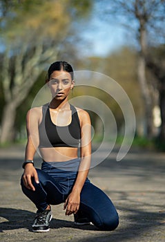 Girl, serious and park to exercise, portrait and nature for fitness, relax and workout in city. Outdoor, performance and