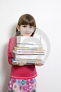 girl seven years old carry books
