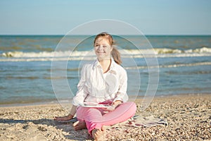 Girl seventeen-year-old with Down syndrome on the beach play wi