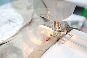 A girl sewing machine for bed sheets do it herself