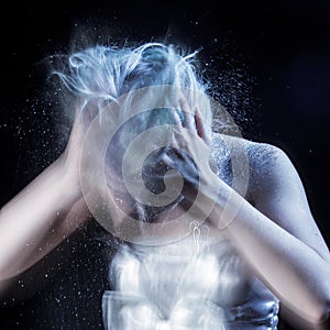 Girl shakes lot of dandruff from head, grotesque photo