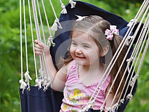 The girl shaking in a hammock