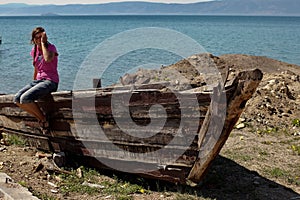 Girl on shipwrecked boat