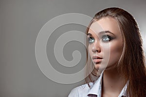 Girl in a shirt looks away