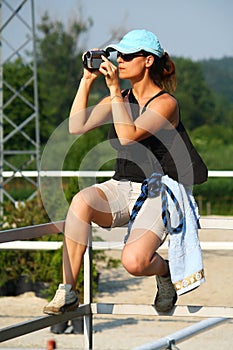 Girl shooting with camcorder