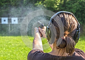 Girl shooting with a gun