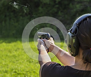 Girl shooting with a gun