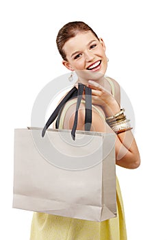 Girl, shopping bag and portrait in studio for fashion, discount or spring sale with logo mockup space. Excited young