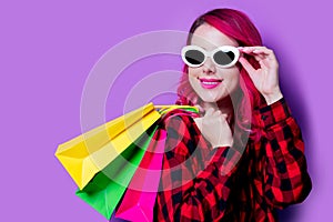 Girl with shopping bags and sunglasses