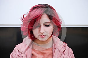 Girl with short pink hair in autumn clothes