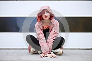 Girl with short pink hair in autumn clothes