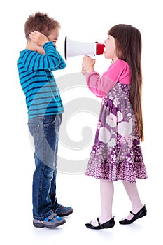 Girl shouting at boy with megaphone