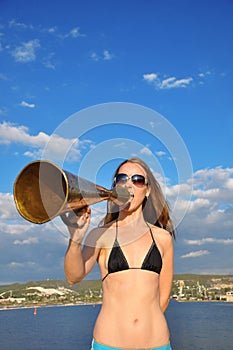 Girl shouting into a megaphone