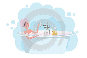 Girl in shower cap taking a bath full of soap foam.Yellow rubber duck in bathtub. Woman takes bath in exquisite bathtub. Relaxing