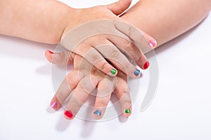 Girl Showing Colorful Nail Polish photo