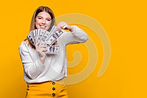 girl showing fan dollars cash