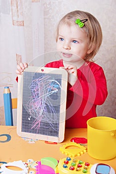 Girl showing her chalkboard drawings