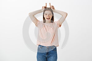 Girl showing her stubbornness and character. Portrait of flirty and sensual good-looking woman in tshirt and jeans