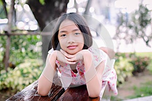 girl showing love sign with hand happy bright cheerful white dress blue skirt