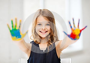 Girl showing painted hands