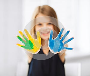 Girl showing painted hands