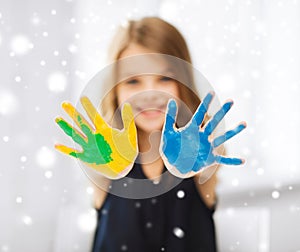 Girl showing painted hands