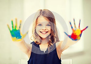 Girl showing painted hands