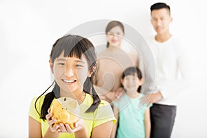 girl showing the piggy bank and family finance concept