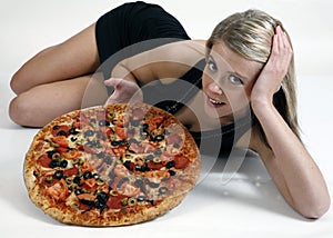 Girl showing pizza