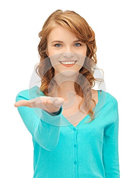 Girl showing something on the palm of her hand