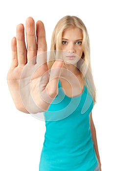 Girl showing stop sign