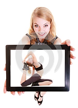 Girl showing tablet with fitness fit woman. Sport.