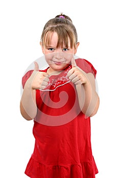 Girl showing thumbs up gesture isolated on white
