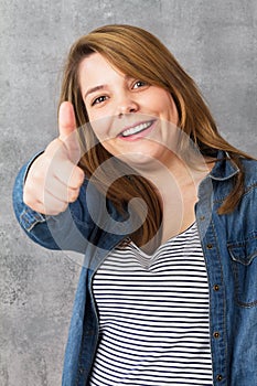 Girl showing thumbs up - okay