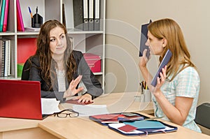 Girl shows HR specialist diplomas which she does not want to look