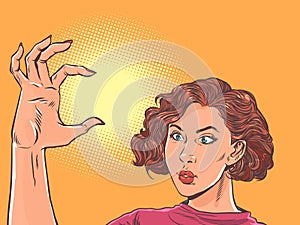 The girl shows the size with her hand. Estimate the size of an object in your head. Small volume in hand. Pop Art Retro