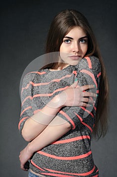 Girl shows tenderness against a dark background